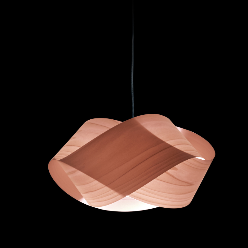 The Nut Suspension from LZF Lamps in pale rose in a studio.