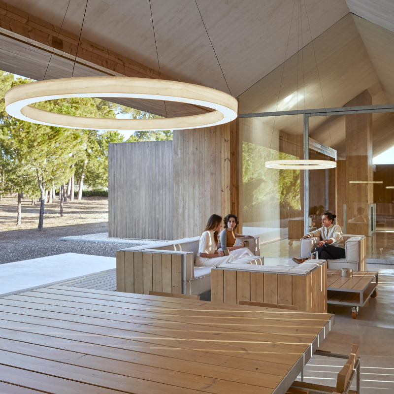 The Oh! Line Suspension from LZF lamps in ivory white in a family room.