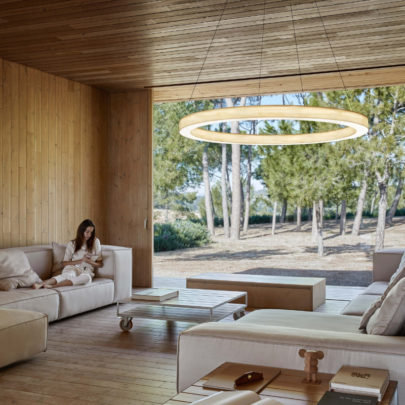 The Oh! Line Suspension from LZF lamps in ivory white in a living room.