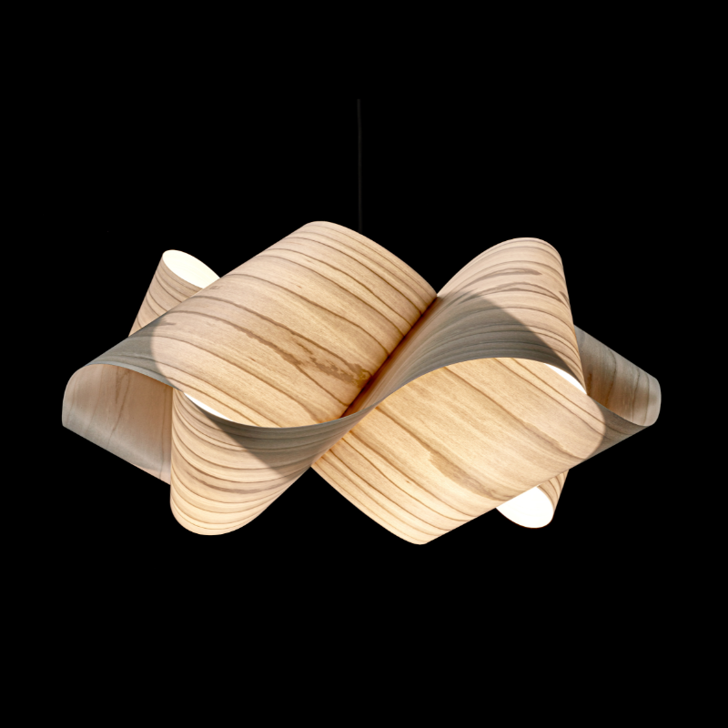 The Swirl Suspension from LZF Lamps in grey in a studio.