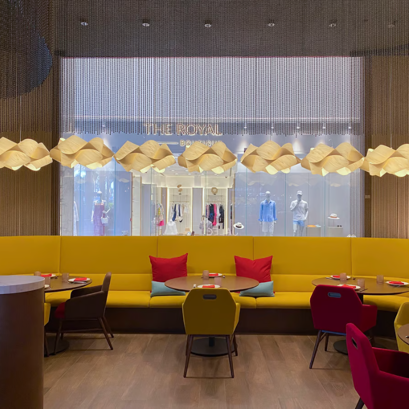 The Swirl Suspension from LZF Lamps in ivory white in a commercial space.