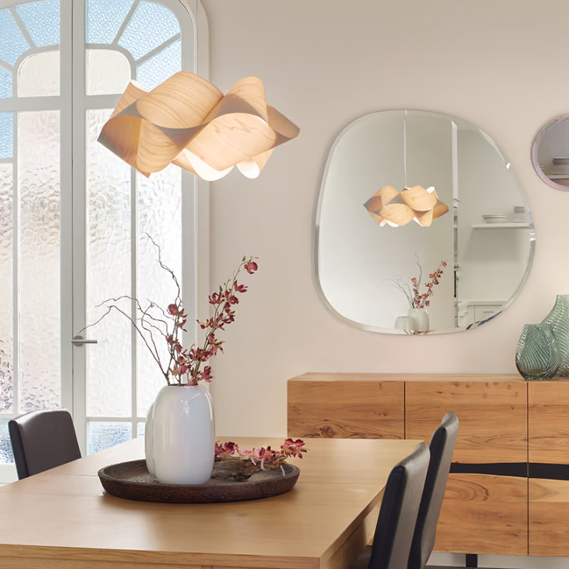 The Swirl Suspension from LZF Lamps in ivory white in a dining room.