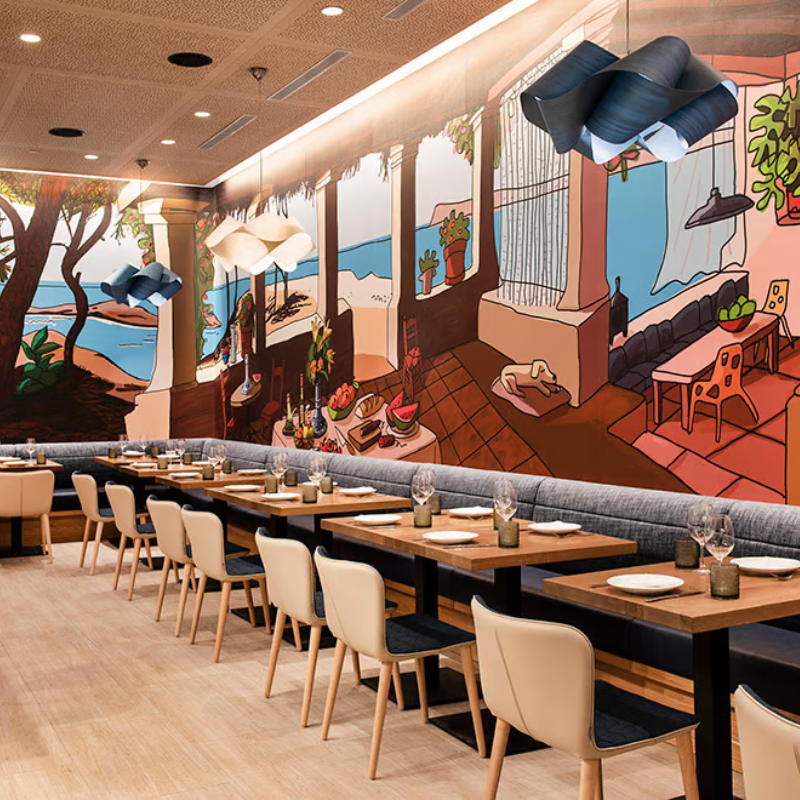 The Swirl Suspension from LZF Lamps in ivory white in a restaurant.