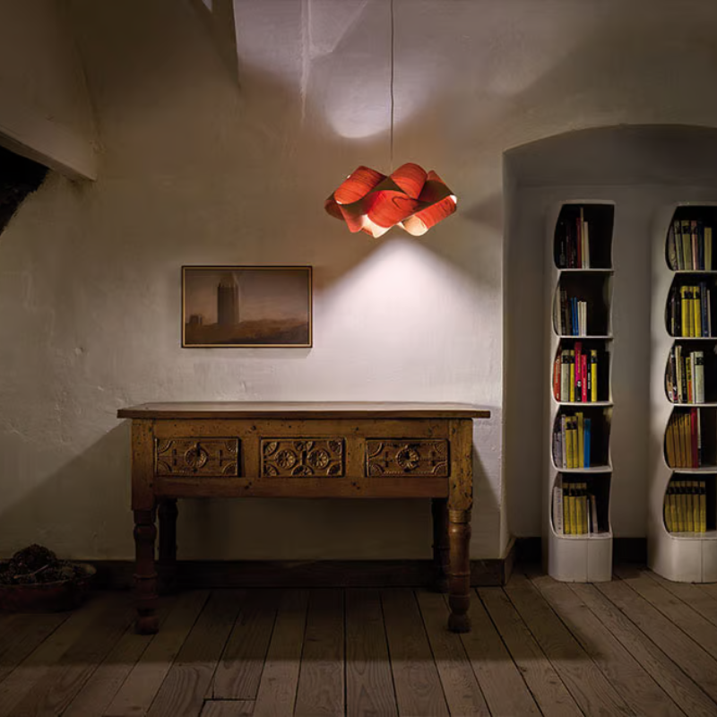 The Swirl Suspension from LZF Lamps in natural cherry in a family room.