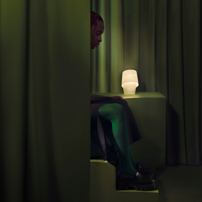 The Tiny Table from LZF lamps in ivory white in a primary bedroom.