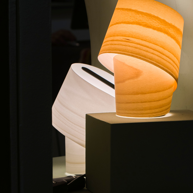 The Tiny Table from LZF lamps in natural beech in a living room.