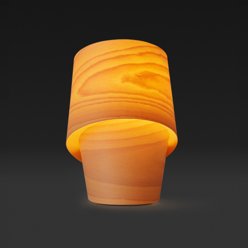 The Tiny Table from LZF lamps in natural beech in a studio.