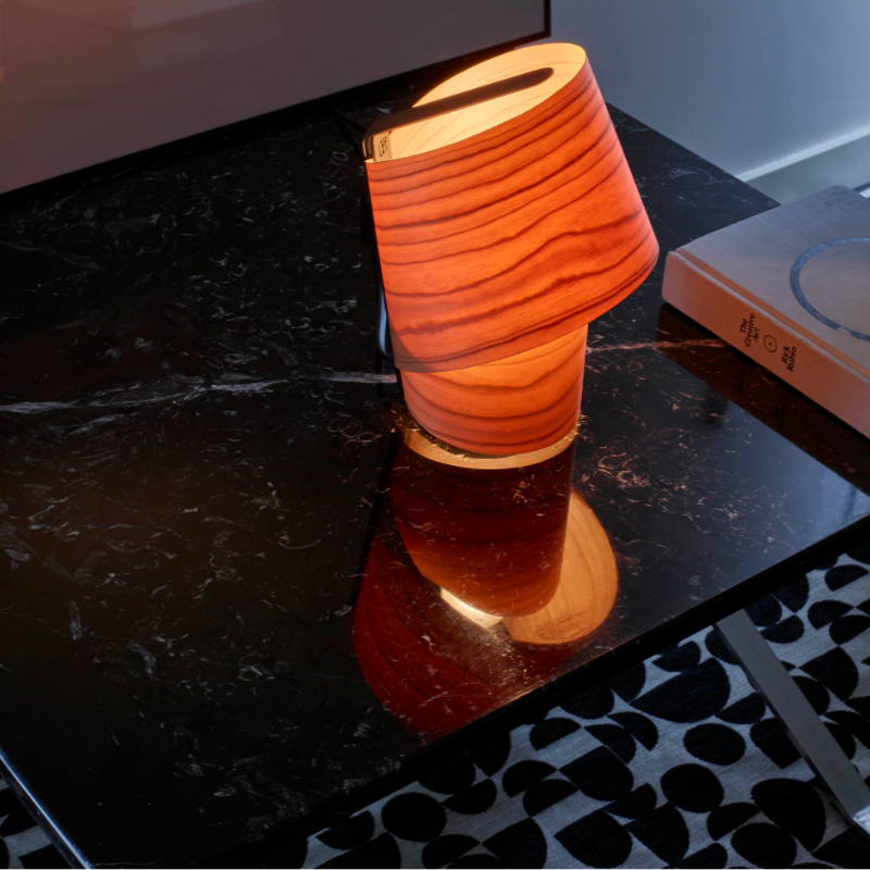 The Tiny Table from LZF lamps in orange in a lounge.