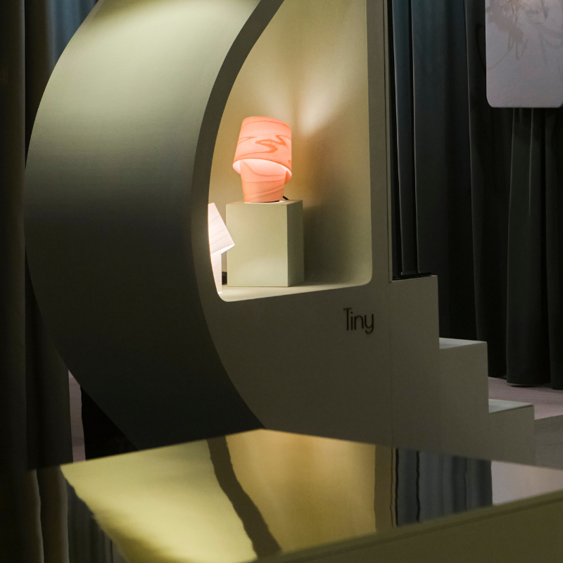 The Tiny Table from LZF lamps in pale rose in a showroom.