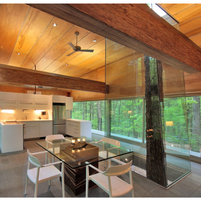 The Altus ceiling fan from Modern Fan Co. in a dining room.