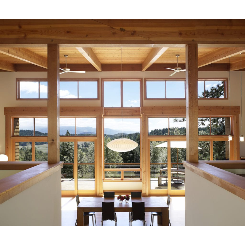 The Altus suspended ceiling fan from The Modern Fan Co. within a lounge area.