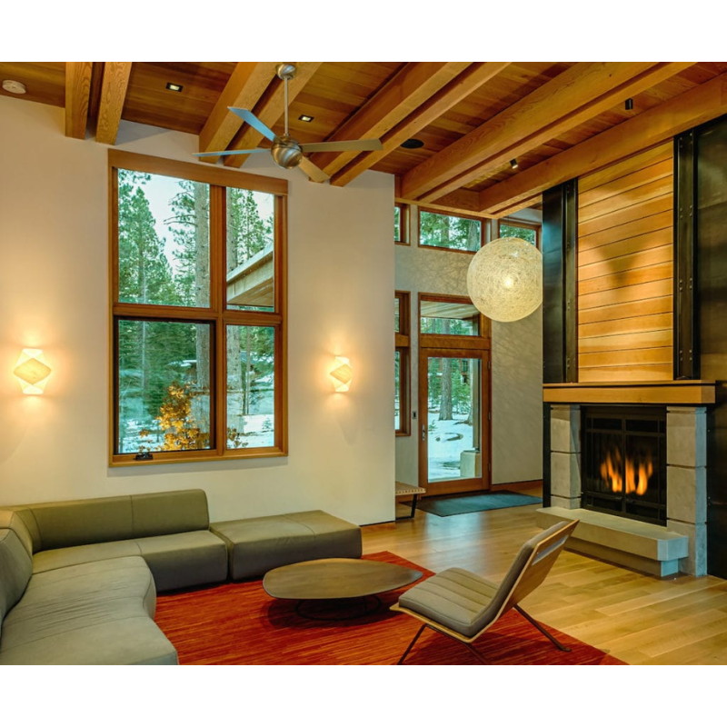 The Ball ceiling fan by Modern Fan Co. in a living room above the sofa.