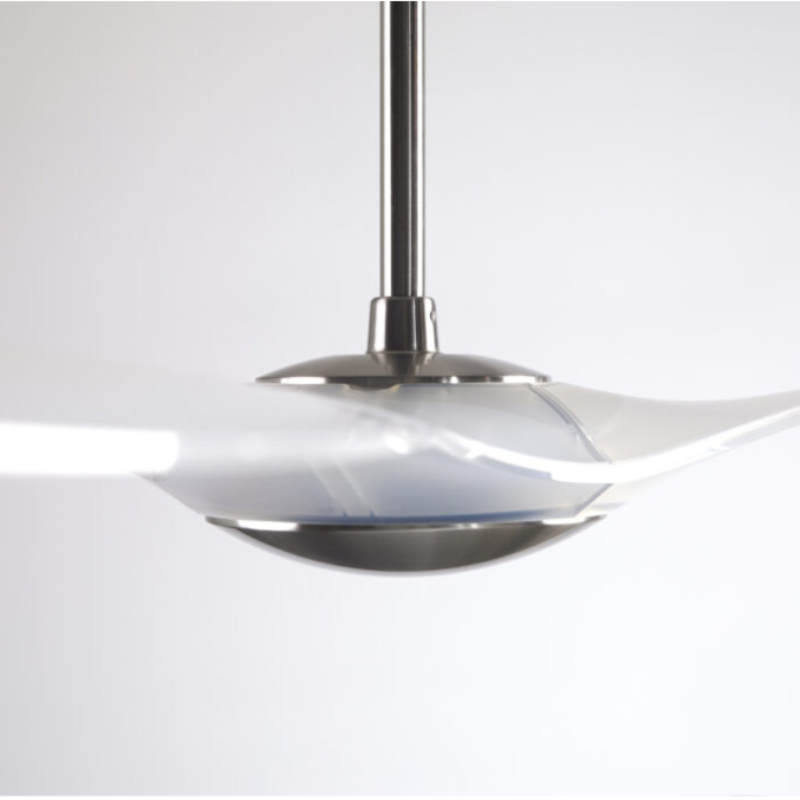 The bright nickel and translucent IC/Brisa DC - 56″ from Modern Fan Co. in a side view within a family space.