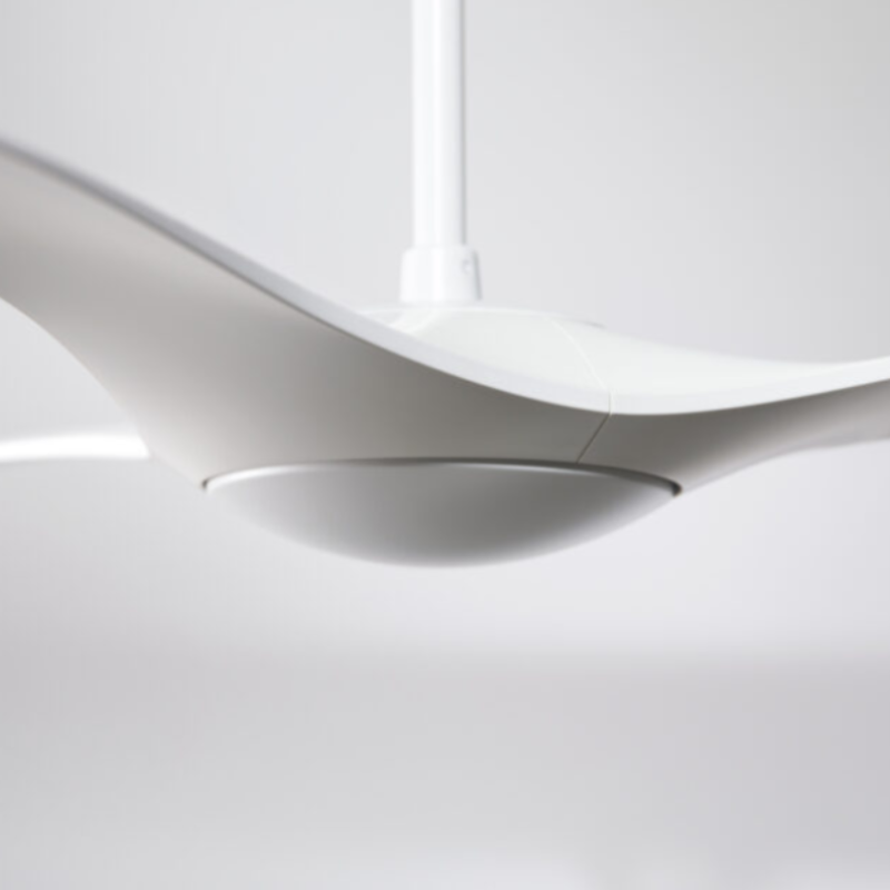 The matte white IC/Brisa DC - 56″ from Modern Fan Co. in a view from the side in a studio.