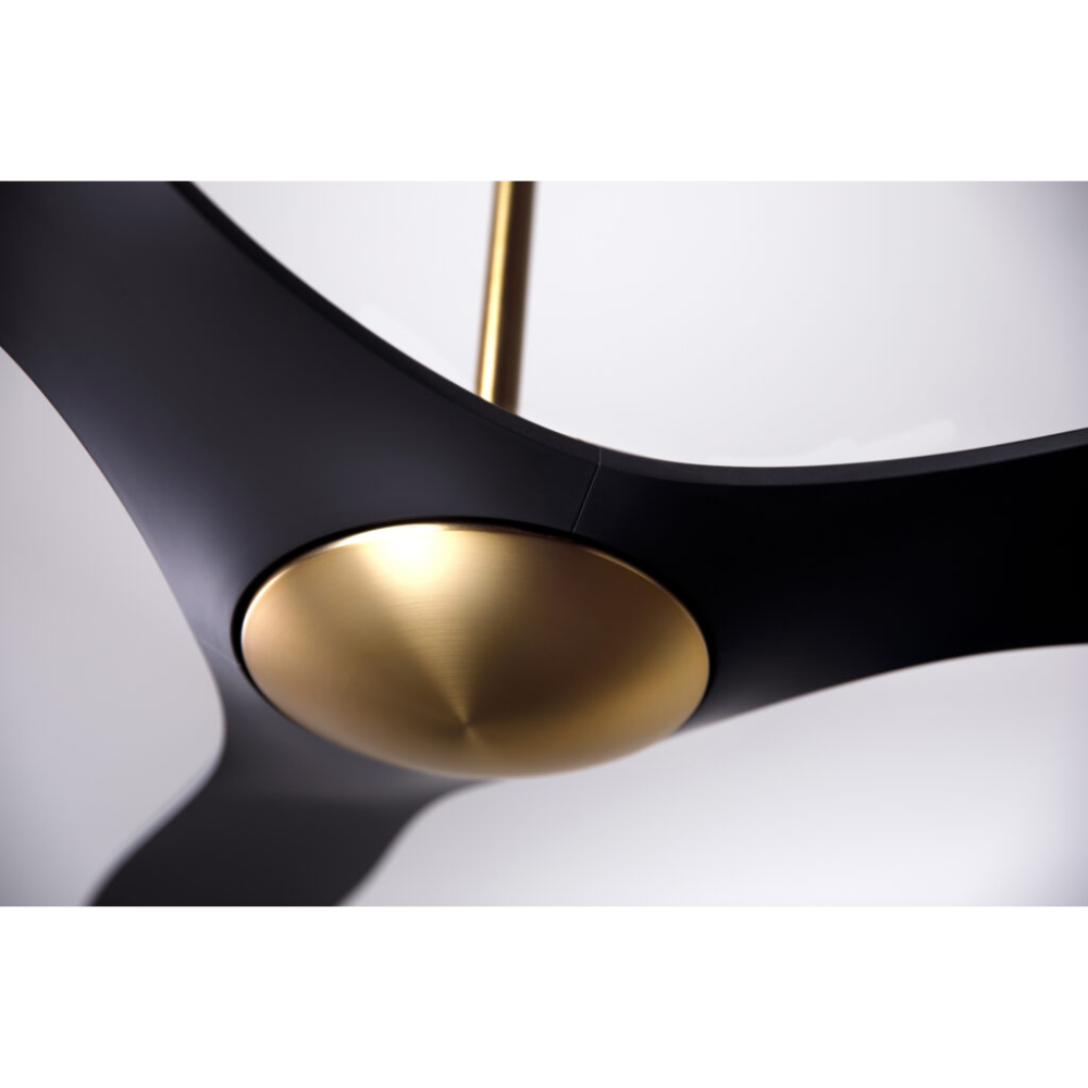 The satin brass and matte black IC/Brisa DC - 56″ from Modern Fan Co. shown in detail within a family area.