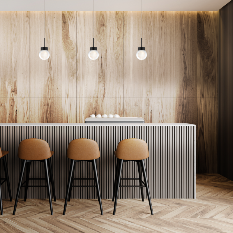 The Double Bubble from Modern Forms in black in a kitchen and dining area.