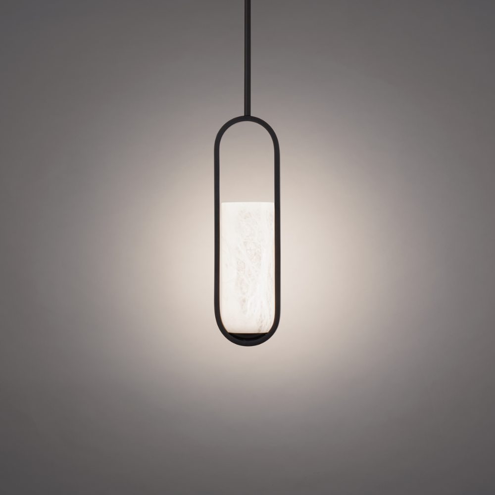 The black Rollins Pendant Light from Modern Forms in a living room.