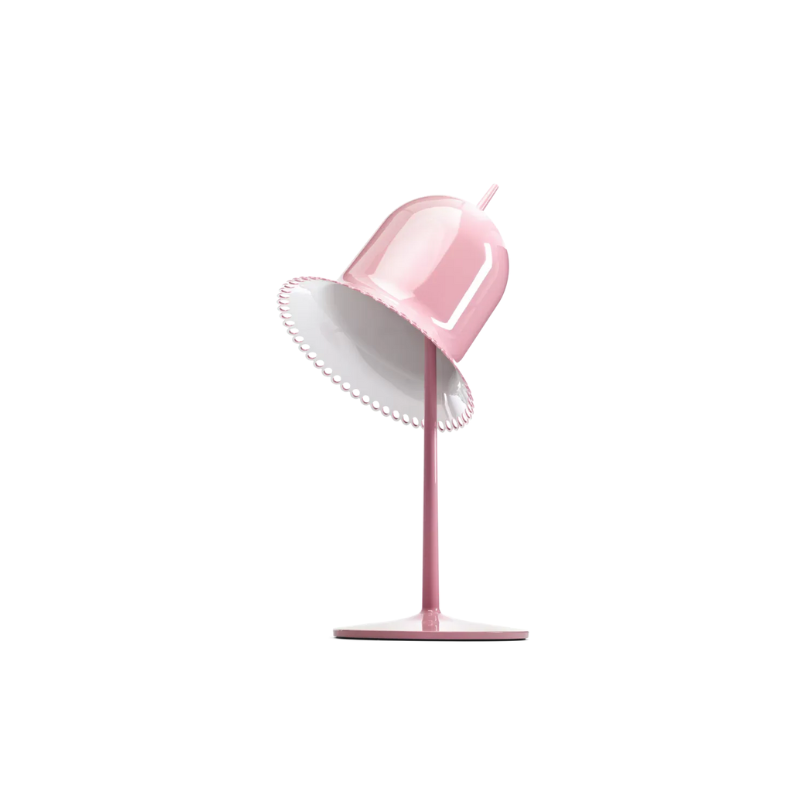The pink Lolita Table Lamp from Moooi with the lampshade tilted.