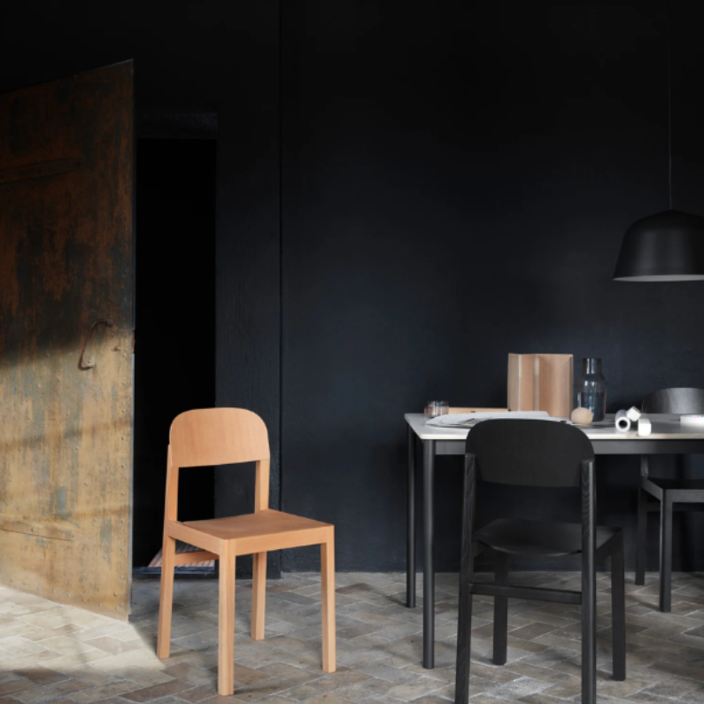 The black Ambit Pendant Lamp from Muuto in a living space.
