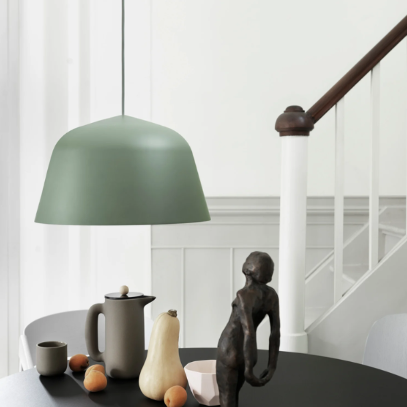 The dusty green Ambit Pendant Lamp from Muuto in an entryway.