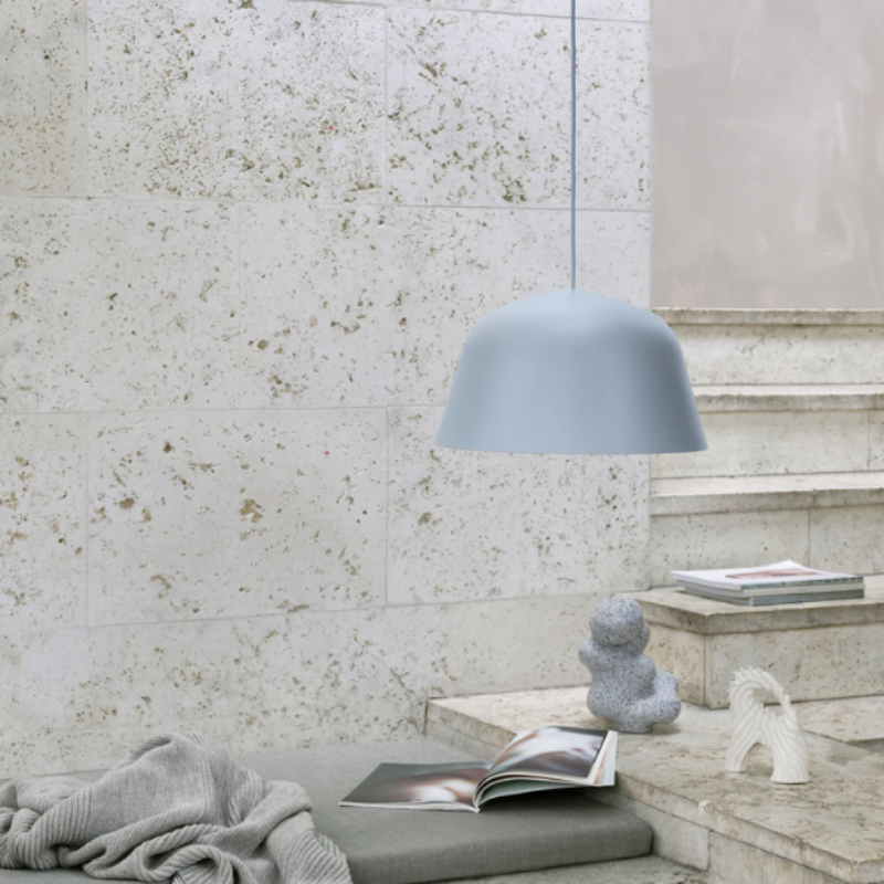 The light blue Ambit Pendant Lamp from Muuto in a lounge.