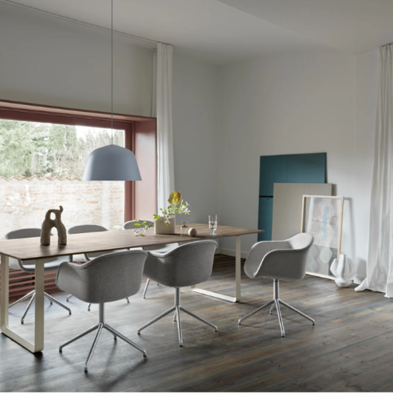 The gray Ambit Pendant Lamp from Muuto in a family space.