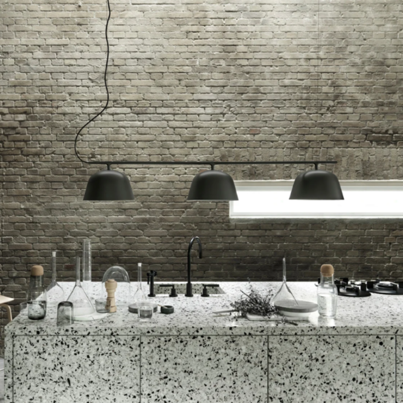 The black Ambit Rail Lamp from Muuto in a kitchen.