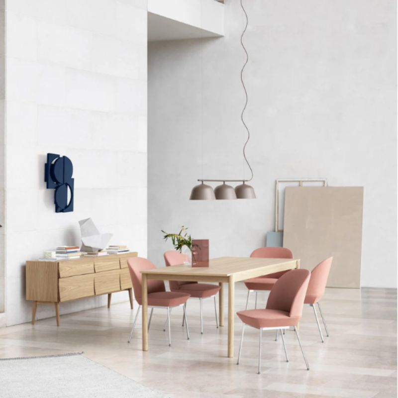 The taupe Ambit Rail Lamp from Muuto in a family space.