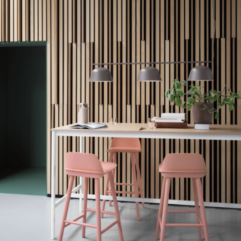 The taupe Ambit Rail Lamp from Muuto in a living room.