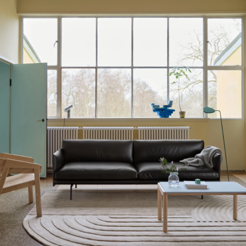 The aluminum Beam Table Lamp from Muuto in a living room.