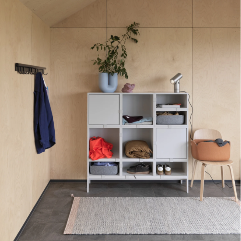 The aluminum Beam Table Lamp from Muuto in a primary bedroom.