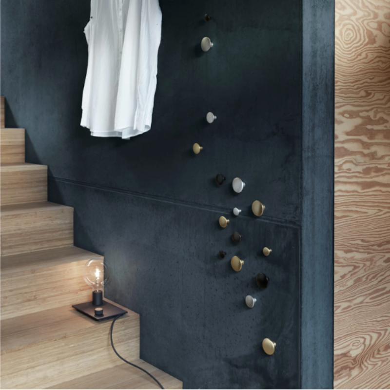 The black Control Table Lamp from Muuto in a hallway.