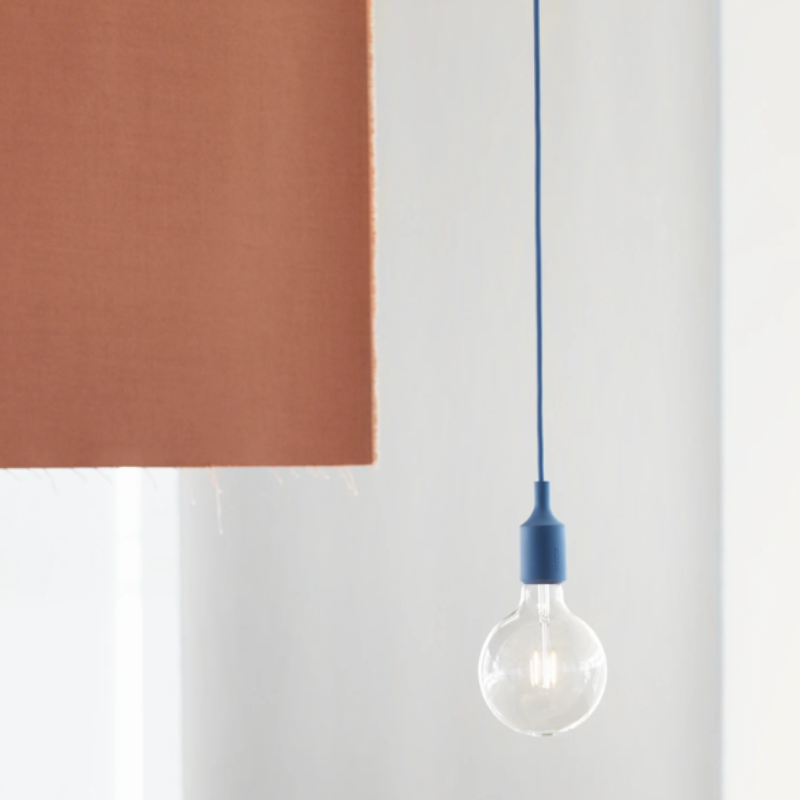 The blue E27 Pendant Lamp from Muuto in a home office.