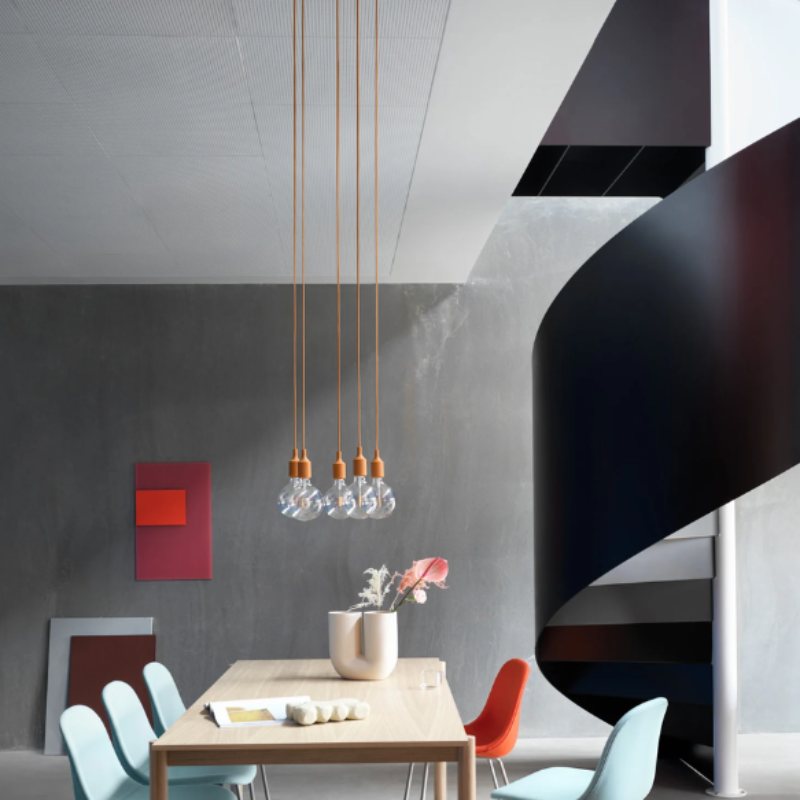 The clay brown E27 Pendant Lamp from Muuto in a dining area.