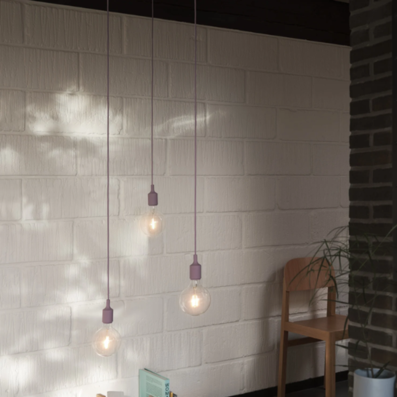The dusty lilac E27 Pendant Lamp from Muuto in a lounge.