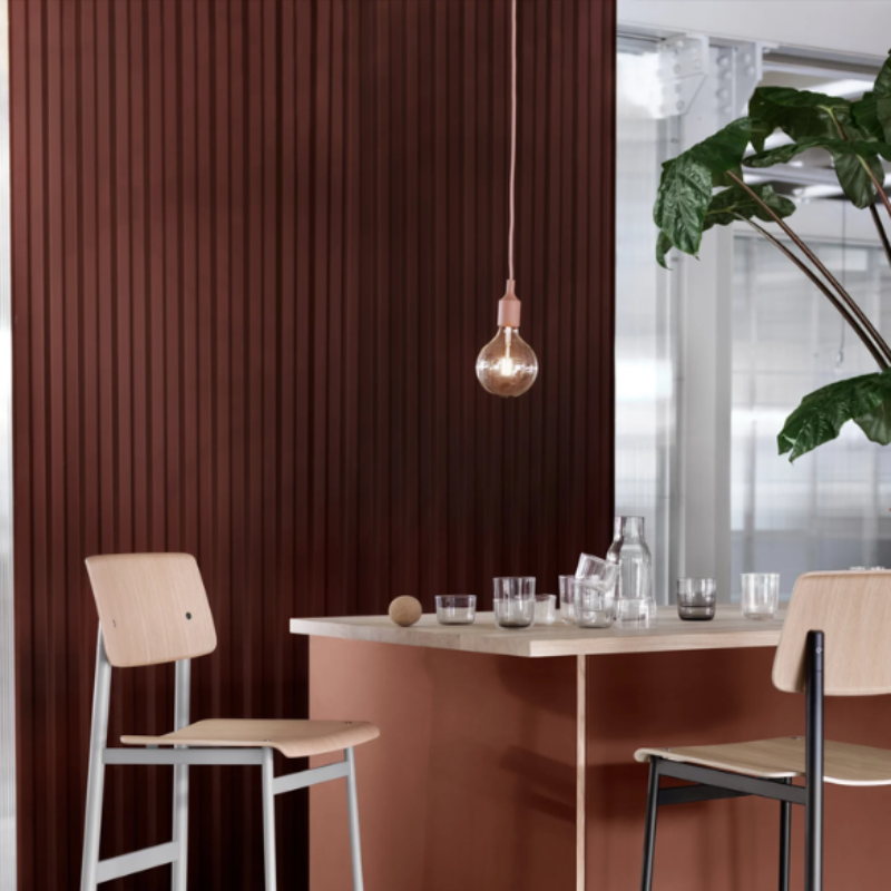 The rose E27 Pendant Lamp from Muuto above a kitchen bar.