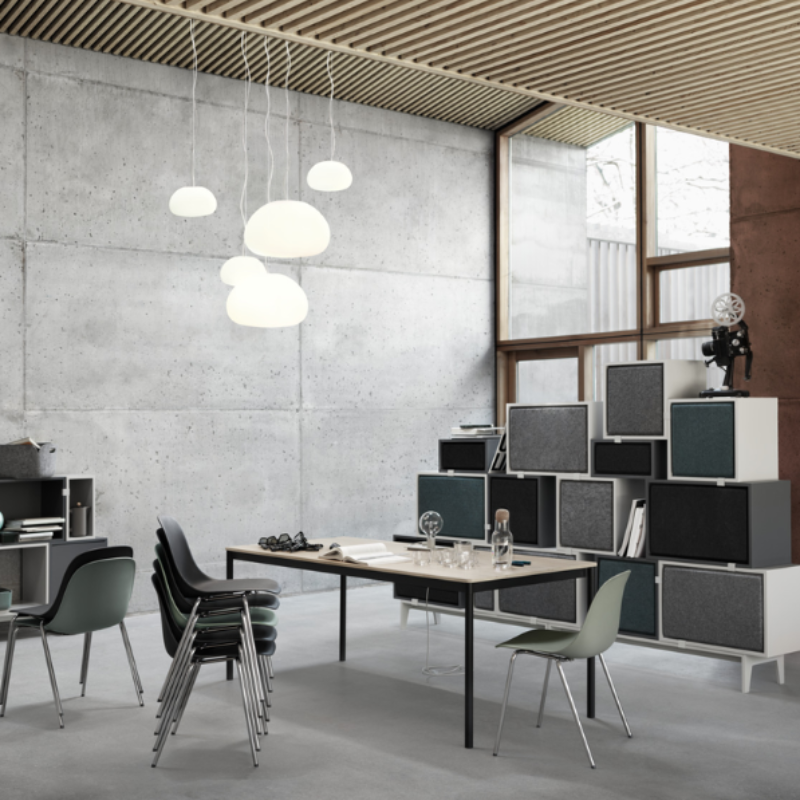 Two large Fluid Pendant Lamps from Muuto in an art studio.