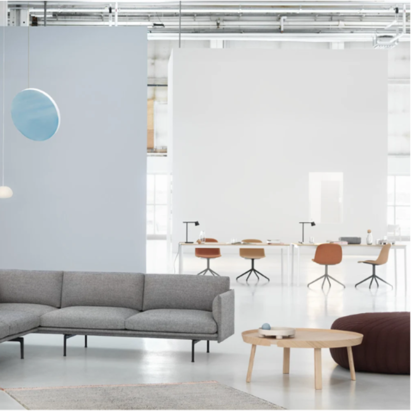 The small Fluid Pendant Lamp from Muuto in a business space.