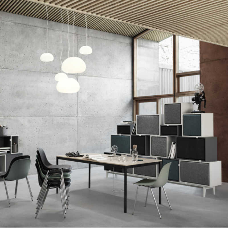 Three small Fluid Pendant Lamps from Muuto in an open space home.