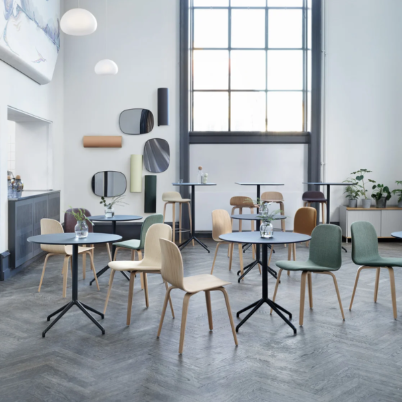 Two small Fluid Pendant Lamps from Muuto in a restaurant.