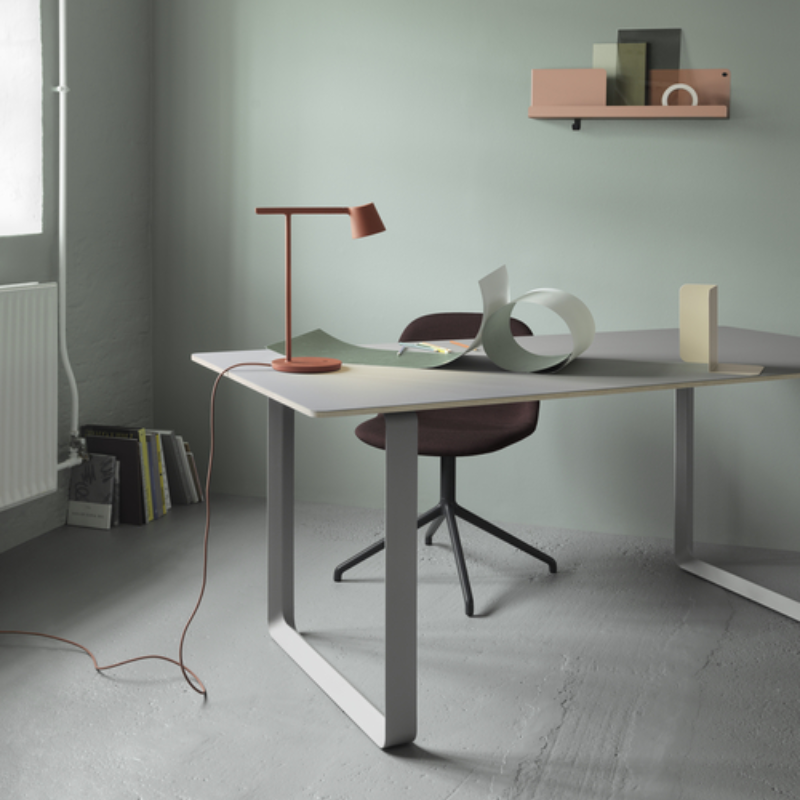 Folded Wall Shelf by Muuto in Burnt Orange in an office.