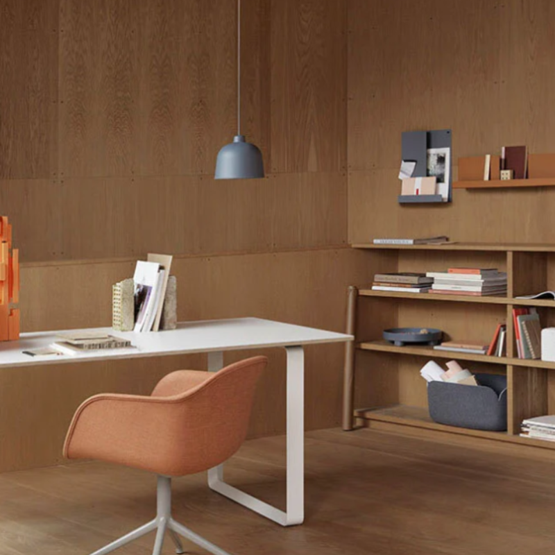 The blue gray Grain Pendant Lamp from Muuto in a meeting room.