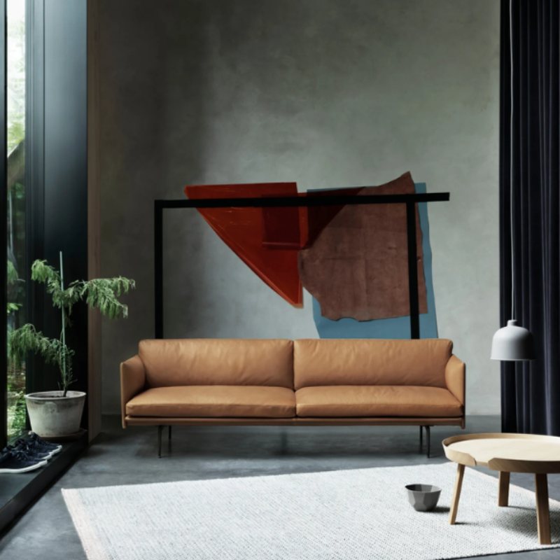 The gray Grain Pendant Lamp from Muuto in a lounge.