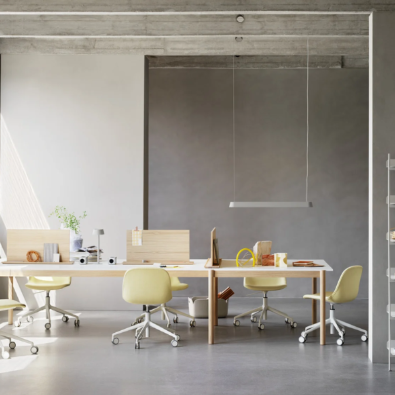 The gray Linear Pendant Lamp from Muuto in a commercial space.