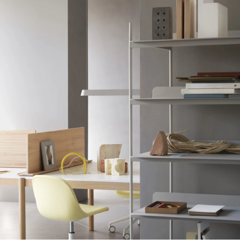 The gray Linear Pendant Lamp from Muuto in a home office.