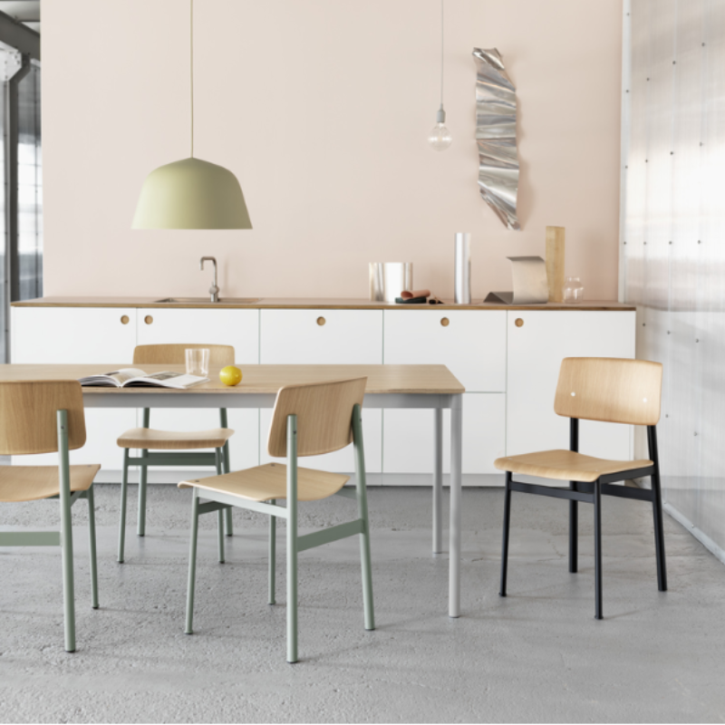 The Loft Chair from Muuto in oak and dusty green in a dining space.