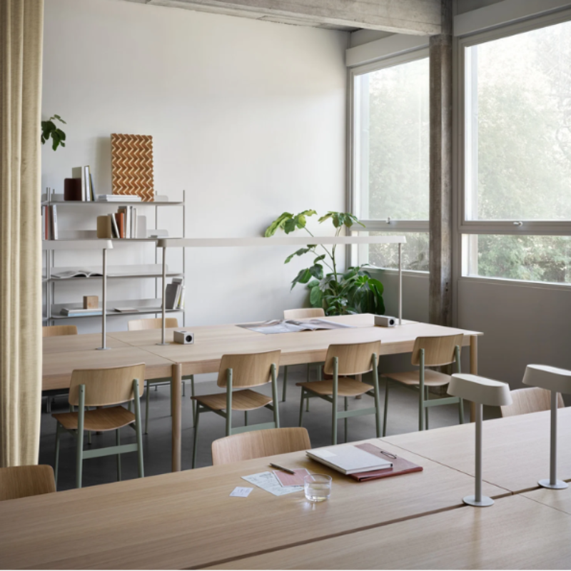 The Loft Chair from Muuto in oak and dusty green in a meeting room.