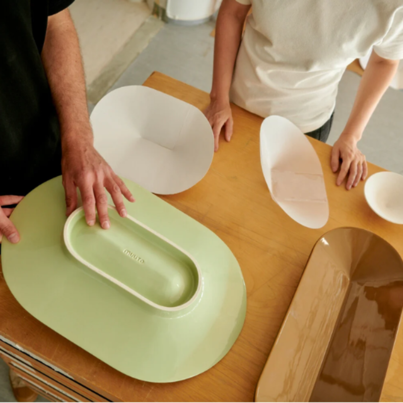 Multiple styles and colors of the Mere Bowl from Muuto as part of a dining set. all-groups