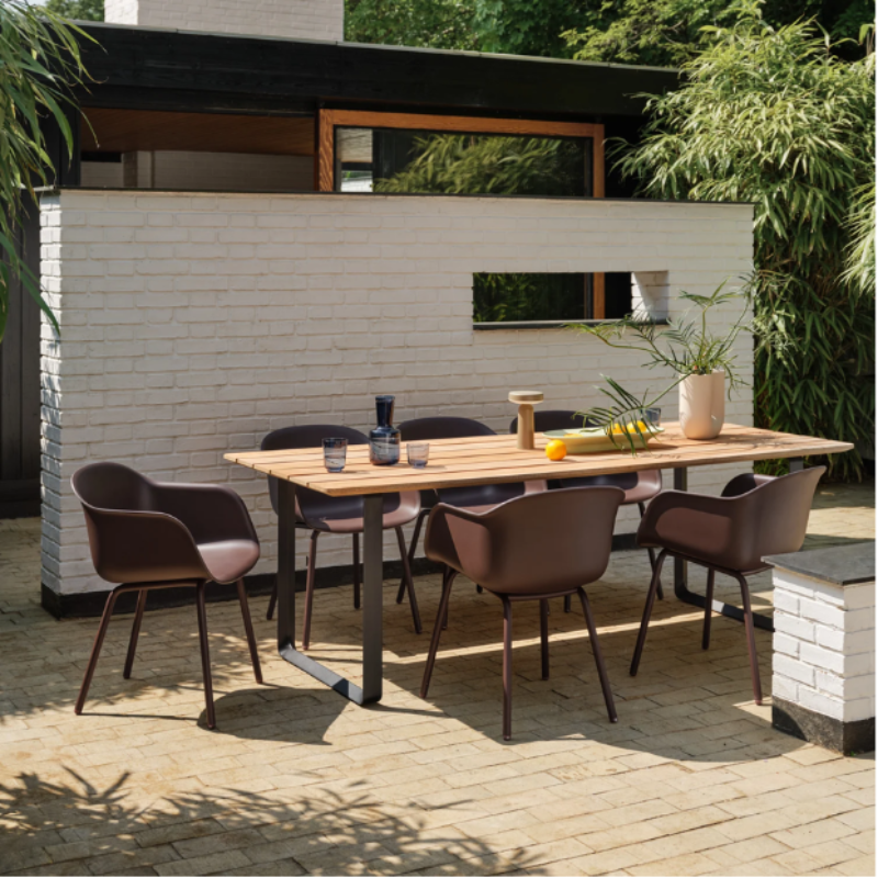 The long Mere Bowl from Muuto in light green within an outdoor lounge.