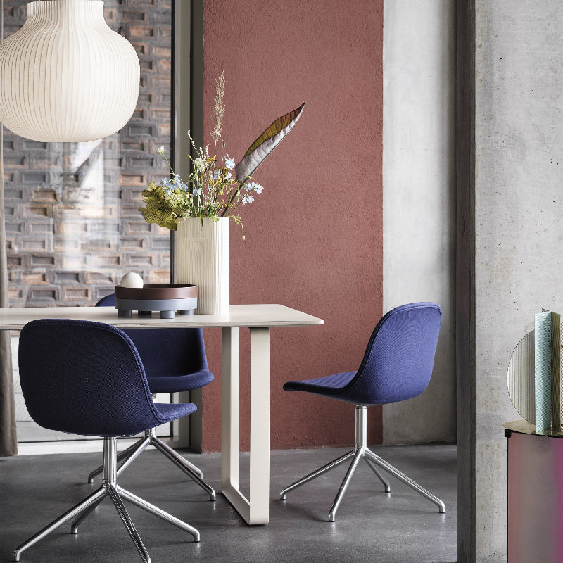 The Platform Tray by Muuto in deep red stacked in a workspace.